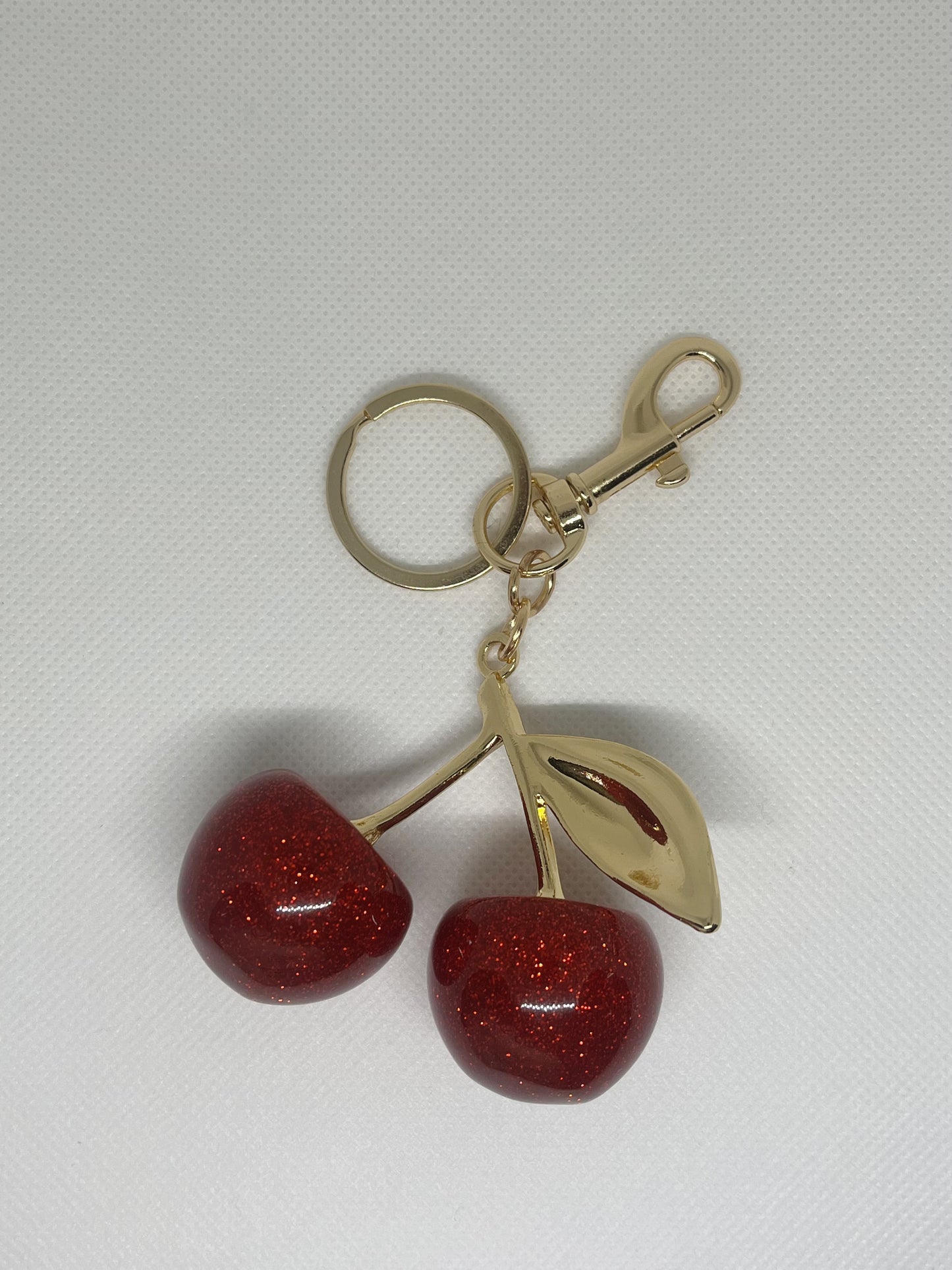 Llavero cherry dorado