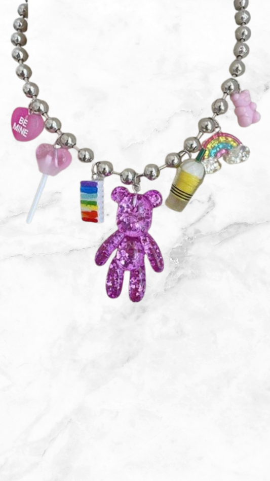 Collar oso morado con accesorios